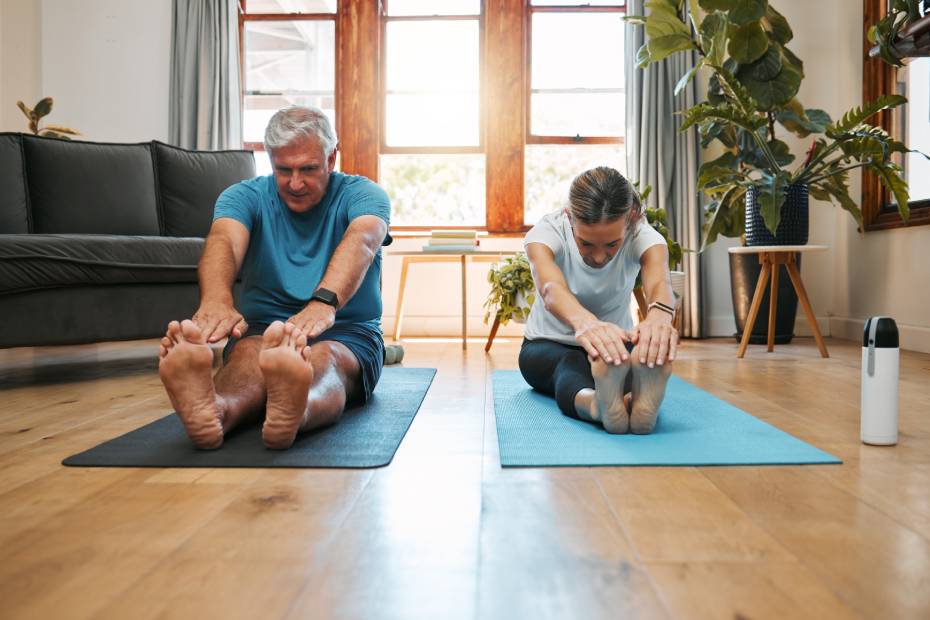 A man and woman doing yoga