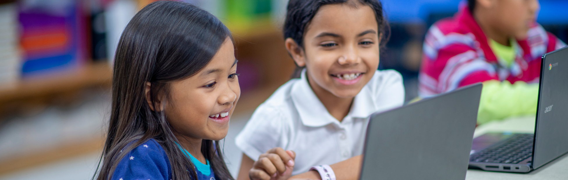 Kids playing on laptop